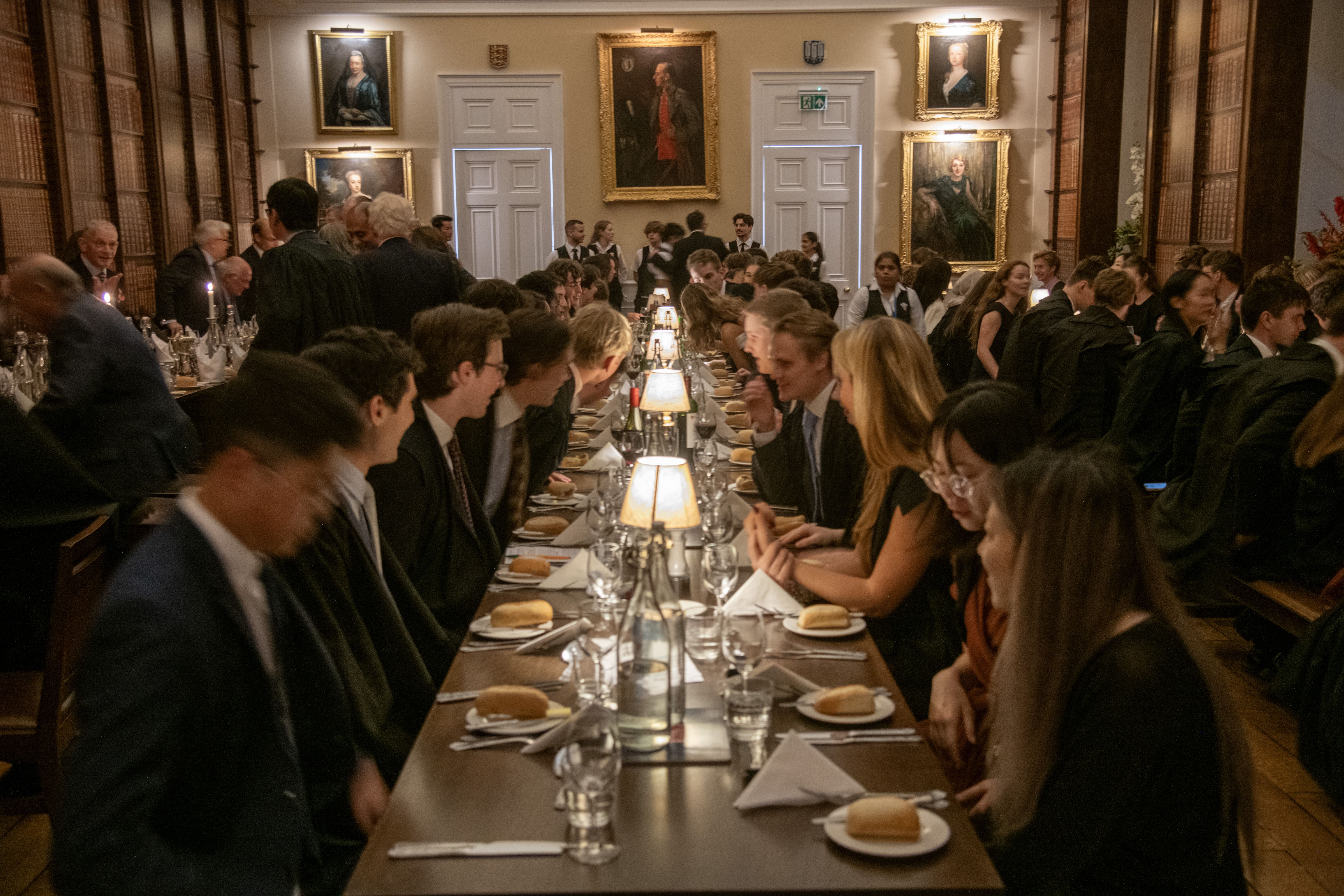 Dining table with students sat around it